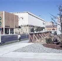 View of the approach to the subway beneath the Downtown Plaza Shopping Center. Macy's is on the left and the Bank of America in the center