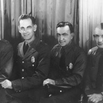 Dorlen E. McGuffee and three other U. S. Immigration officers