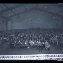 An audience seated in an auditorium