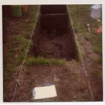 Photographs of landscape of Bolinas Bay. Close up view of archaeological trench, clipboard and tools visible