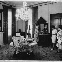 People touring inside of Stanford Home