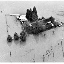 Floodwaters Surround Farm House