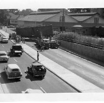 Exterior view of the 12th Street Overpass showing a railcar having derailed