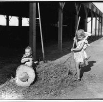 Girl and Baby with Hay