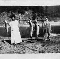 Postcard of one of the Two Sisters (north) at the mouth of the Klamath River, looking east
