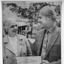 Dr. Irene Hickman, the outgoing Sacramento County Assessor, giving an award to Sacramento developer Marvin "Buzz" Oates. (The name is misspelled with only one Z on the certificate.)