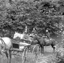 Family riding horses