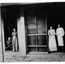 East side of Main Street with Wilson Store on left and Schoetteen Butcher Shop on right, about 1895