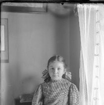 Young girl posing in window