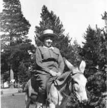 Woman riding a donkey