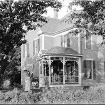 Family portrait on front porch of house