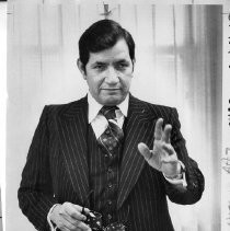 Dr. Ray (Raymond) Jallow, United California Bank, VP and Chief Economist. He is speaking at a lectern. Caption: ...hurry if you worry