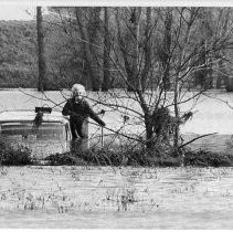 Woman Waits for Rescue from Flood