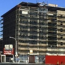 View of the west wall of the Traveler's Hotel during rehabilitation