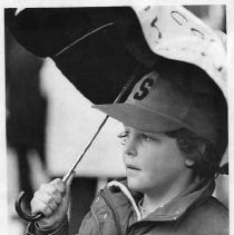 Nathan Doyel joins his mother and other teachers picketing in the rain for better pay and benefits