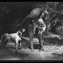 Man carrying dead deer