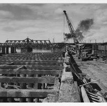 Exterior view of the dismantling of the old Southern Pacific docks on the east side of the Sacramento River from J Street to the Tower Bridge