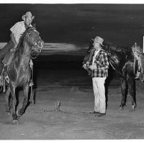 Dr. Walter R. Bell, a Reno dentist swinging into the saddle after receiving the mail pouch from attorney Bruce Thompson