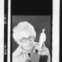 Mary Jackson, home economics director of the Sacramento Bee, holds the first-place trophy for outstanding men's wear coverage, at the fashion industry's 17th annual Lulu Awards in Chicago