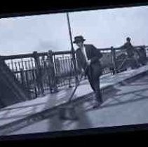 Two men standing on the I street bridge