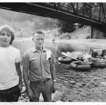 Barney Green (right) owner of the dredge shown and Charlie Johnson (14) are among the miners working the North Yuba River