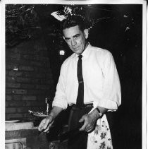 Albert Harrington preparing chicken at barbeque