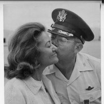 Col. Charles C. Heckel, who has commanded McClellan AFB since 08/01/1974, kisses his wife after his retirement ceremonies