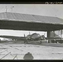 A single engine airplane parked in a hangar