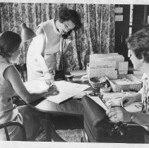 Mrs. Frank M. (Alberta) Jordan on the phone, with two other women