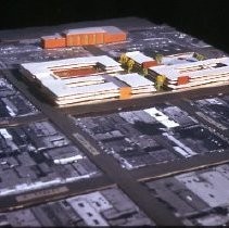 Views of redevelopment sites, renderings, and table models for the proposed Redevelopment District. Includes maps and site plans. This view shows a table model