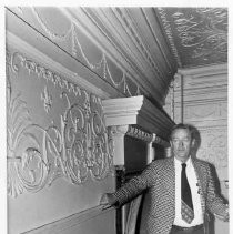 Consulting architect, John Worsley inspects the decorative plaster molding on a wall in the California State Capitol