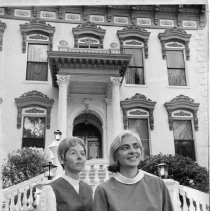 Two women standing outside Stanford Home front entrance