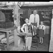 Boy playing an accordian