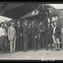 Men standing in front of an airplane