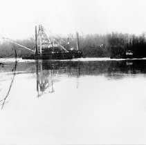 "Dutra Dredge being pulled by Tugboat on the Sacramento"