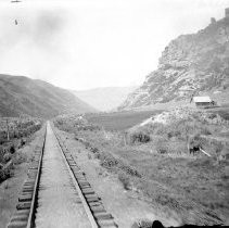 Photograph taken from the back of a railroad car