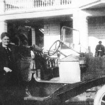 Woman Stands with Car