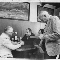 Harold T. "Bizz" Johnson, California state senator (1948-1958) and U.S. Congressman (1958-1981). Here, he talks to voters in a Portola cafe as his field rep takes notes