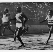 Jim Hines, center, breaking the world record for the 100 meter race at Hughes Stadium on June 20, 1968