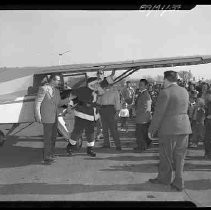 Santa Claus getting out of an airplane