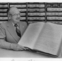 Leonard J. Hooper, Sacramento County Recorder, with an old handwritten record book