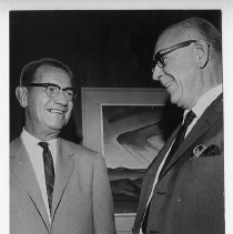 Dr. Guy A. West (right), retiring as Sacramento State College president, shakes hands with successor, Dr. F. Blair Mayne