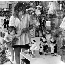 "Lori Eddington and daughter Nicole inspect toys at the 'doll house' section of Citrus Heights Ward"