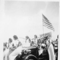 Women on fire truck in a parade