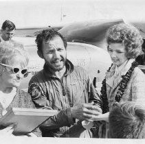 Dr. Alvin Marks, pilot and owner of Skymark Airlines. Here, with his wife Phoebe, standing in front of his plane, greeting people