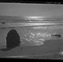 An ocean shore with rocks