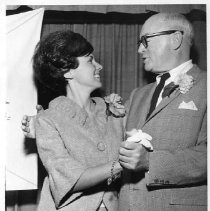 View of Judy Marie Olive, 1966 Camellia Festival Queen poses with Charles Butter of the Camellia Society during the festivities