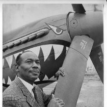 Herman Lawson, an ex-fighter pilot, with a vintage airplane