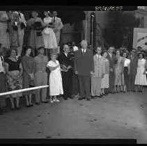 Group of people posed next to Calif. State Fair building