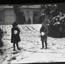 Two children on Capitol grounds in snow